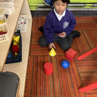 This week in Nursery we continued working hard learning about 2D and 3D shapes, we named and described the shapes using words such as sides, corners, straight, flat and curved.