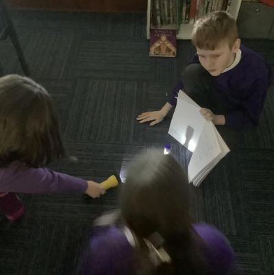 We have been learning about how light travels in Science. We experimented with how shadows are made and how to change the size of a shadow.